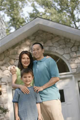 Asian Family In front of new home